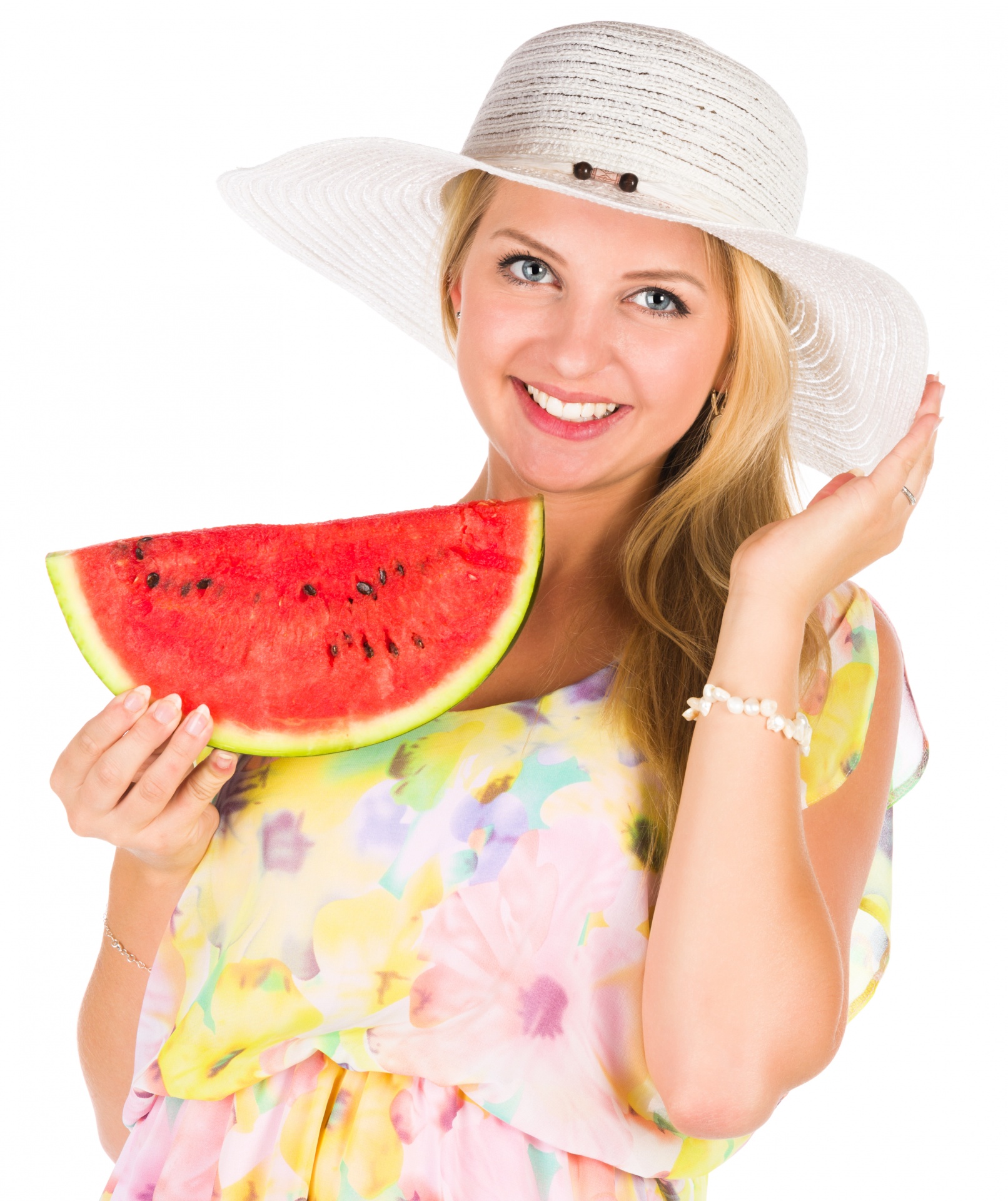 Young woman holding a slice of a watermelon in summer outfit