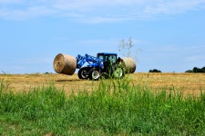 Tractor Loading Hay Bales