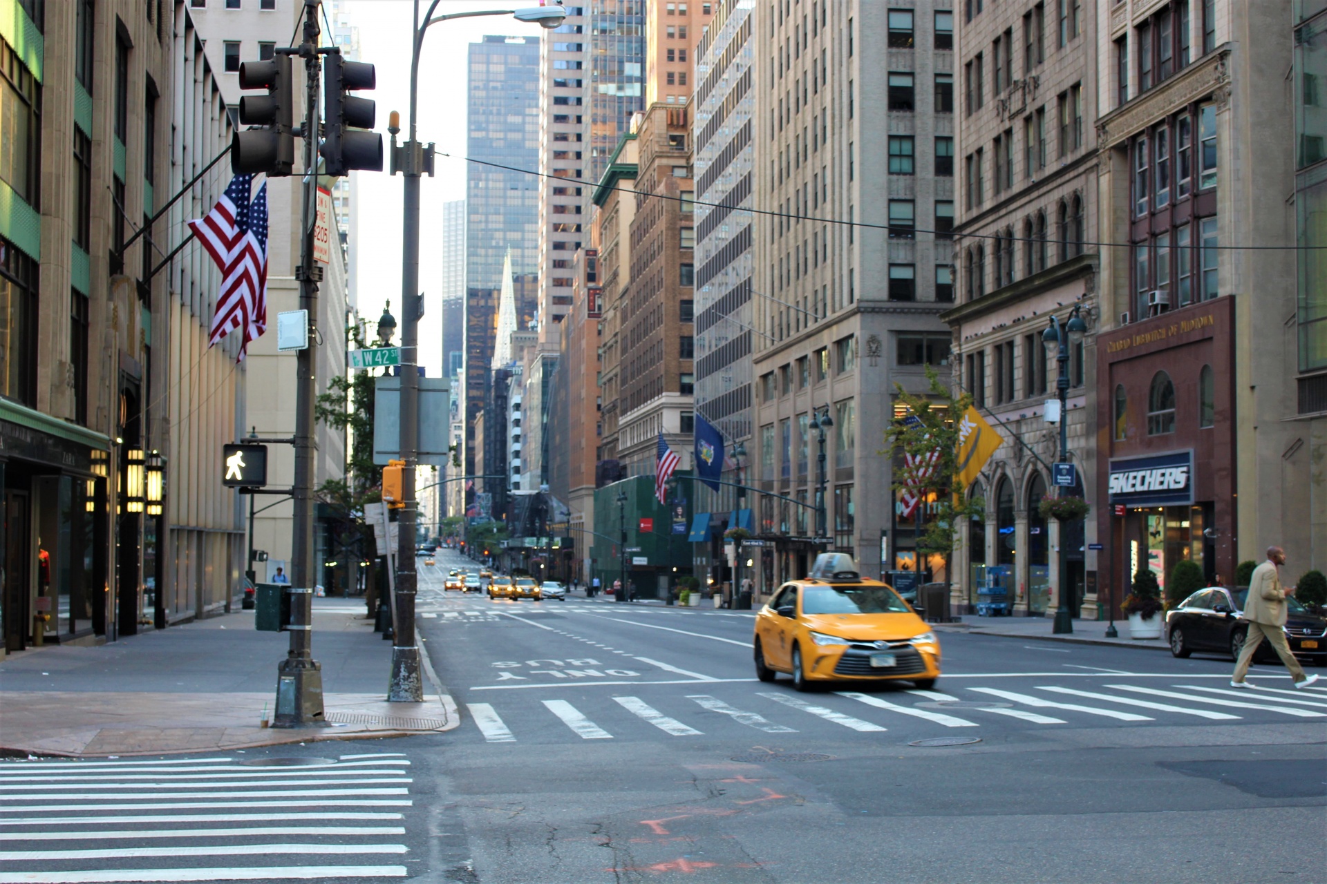 A view up New York's 5th Avenue with iconic yellow taxis
