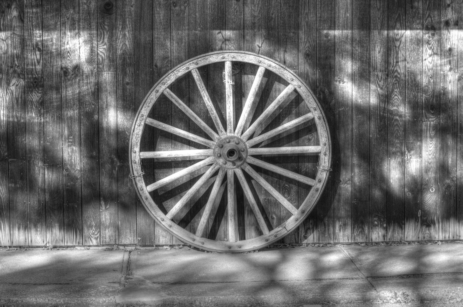 artistic touch applied to photograph of old wagon wheel - black and white