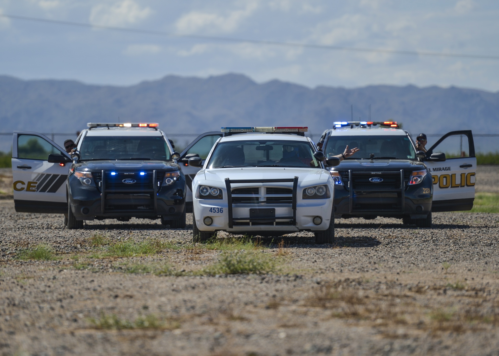 Police officers from around Maricopa County stage an arrest during an exercise as part of an Emergency Vehicle Operations Course held at Luke Air Force Base, Ariz., Aug. 21, 2017.