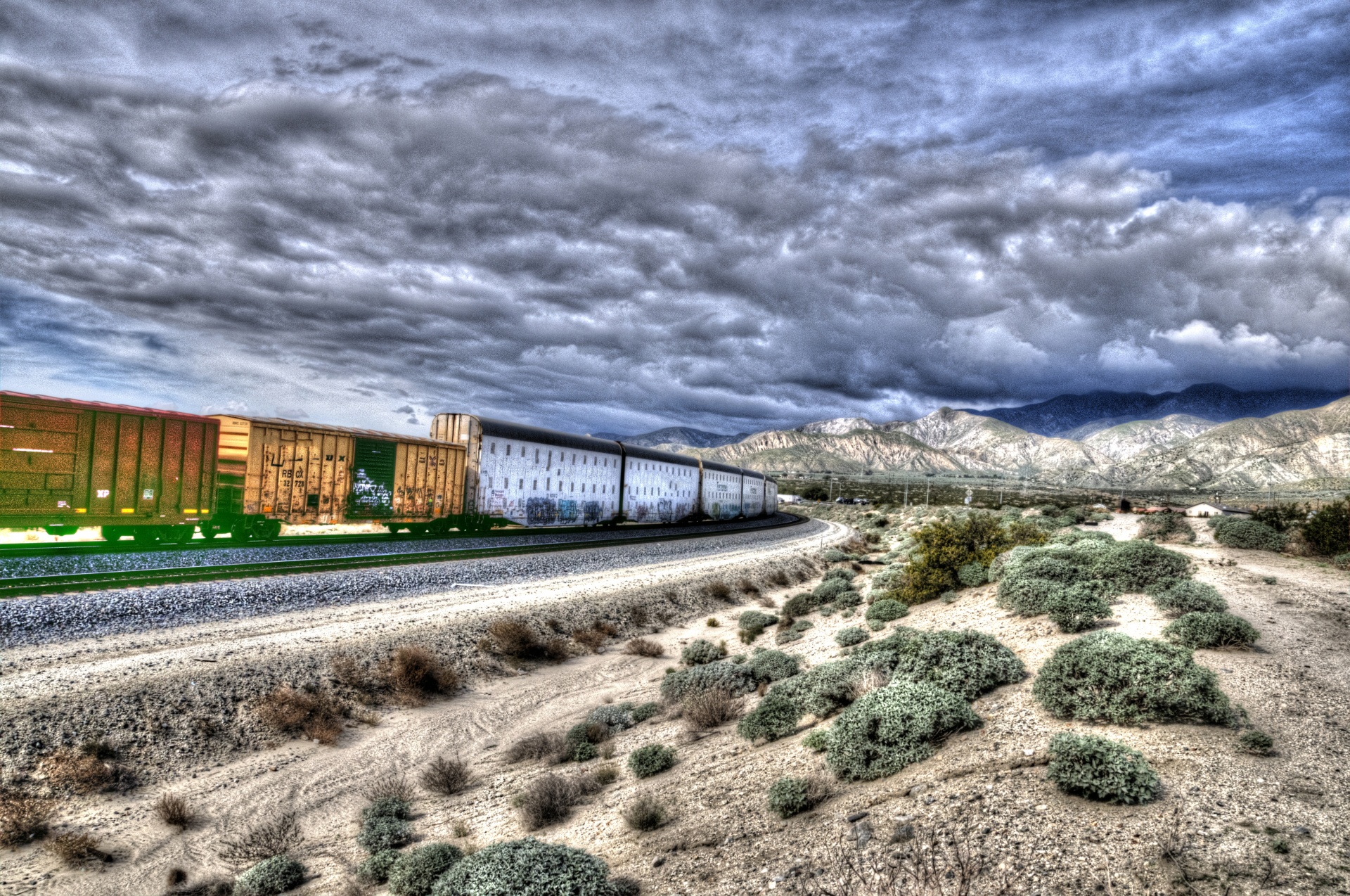 artistic touch applied to landscape photo of train moving through California Desert