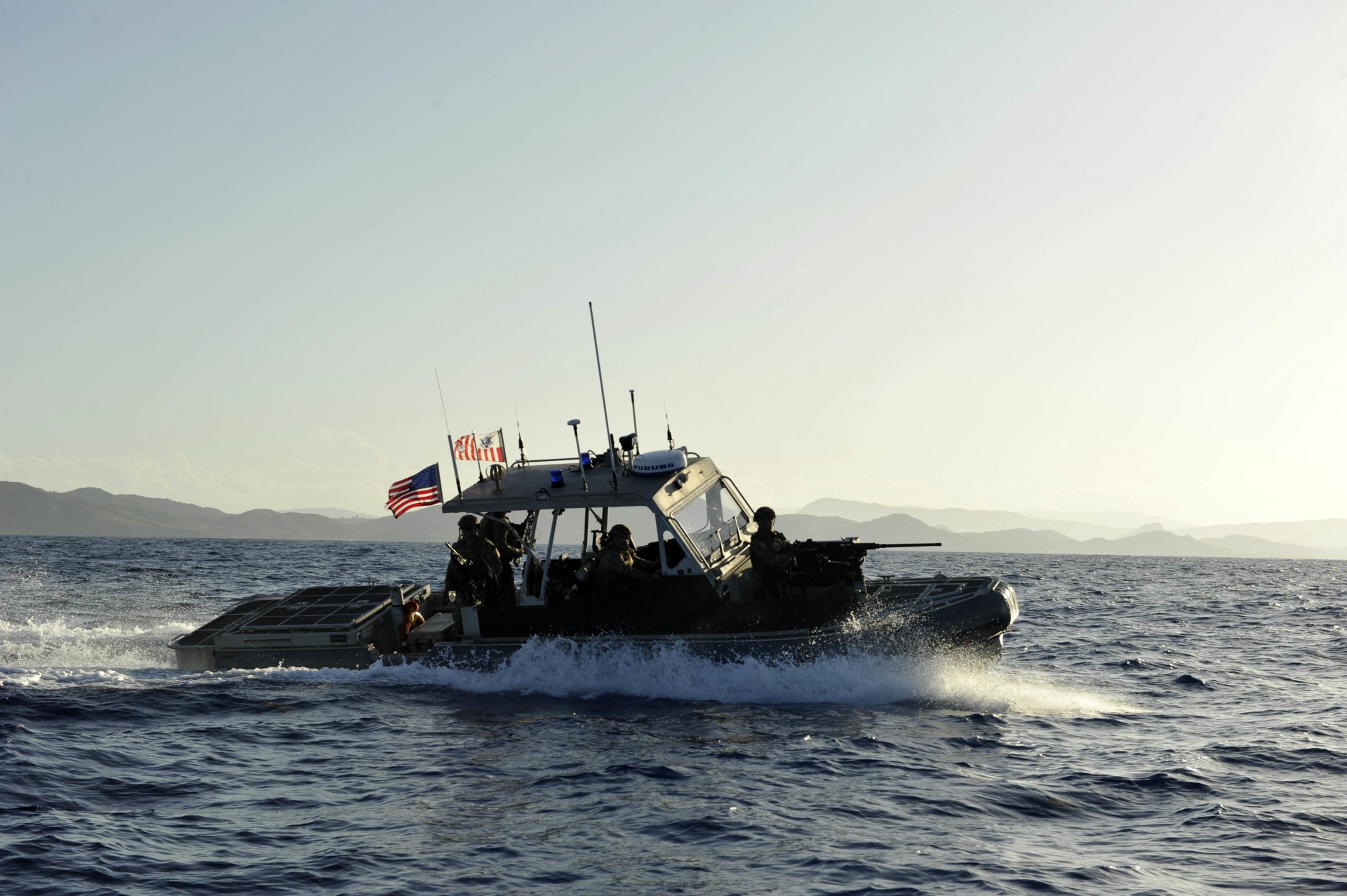 oast Guardsmen from Port Security Unit 305 aboard a 32-foot Transportable Port Security Boat patrol the waters off the coast of Guantanamo Bay, Cuba, Wednesday, July 19, 2017.