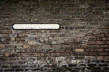 Brick Wall With Blank Sign