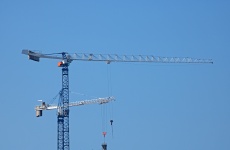 Cranes Against Blue Sky