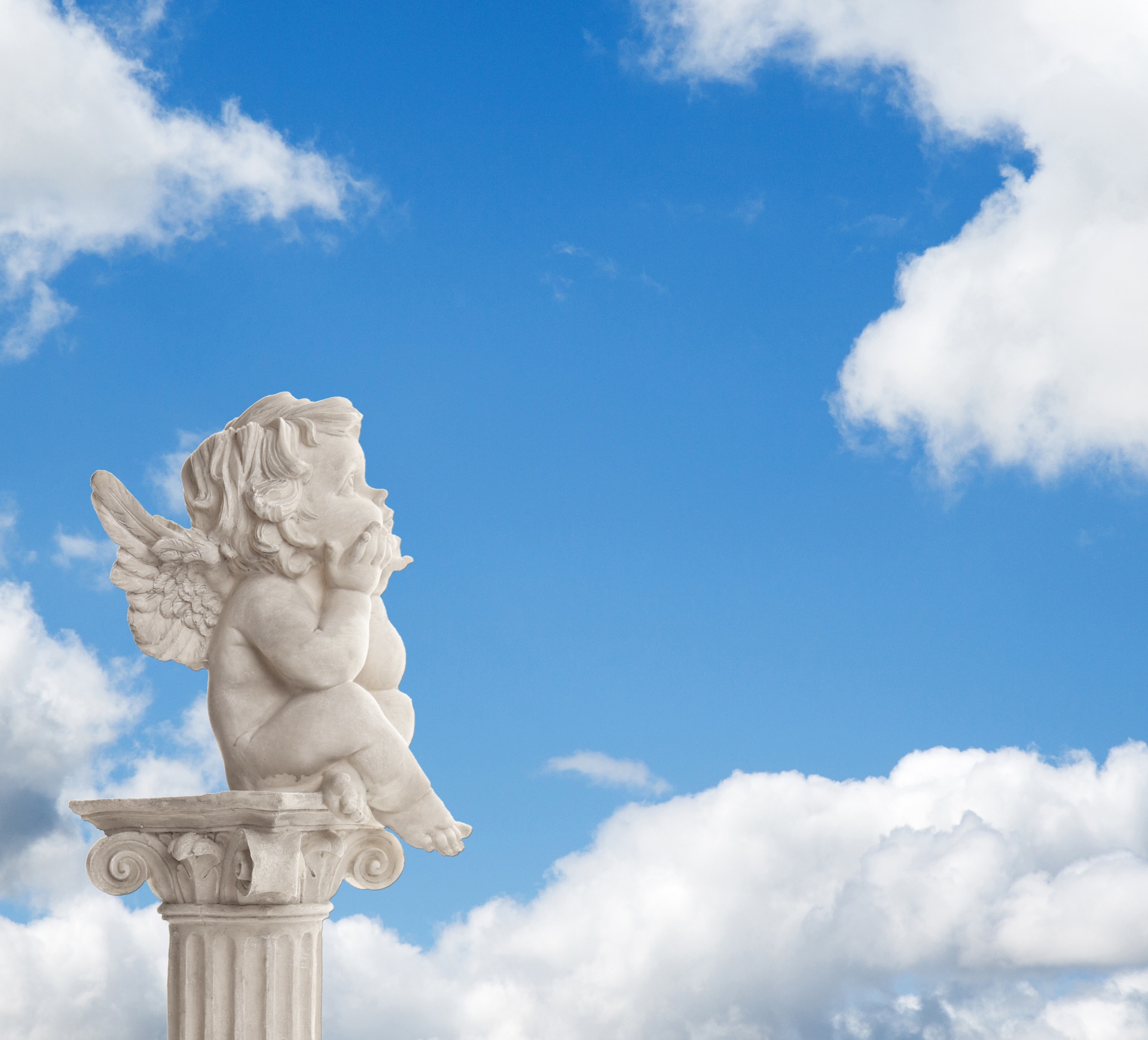 Angel statue in the clouds