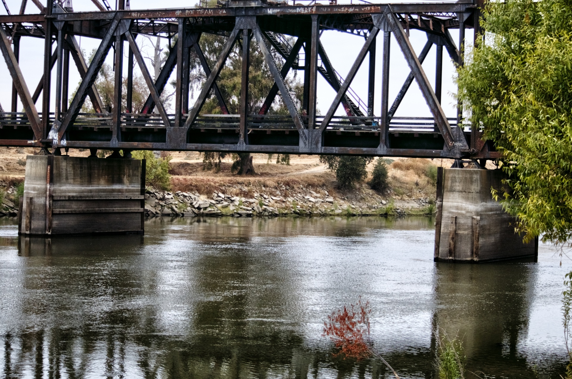 Old rusty bridge reflects off the deepwater channel in Riverpoint, Stockton, California