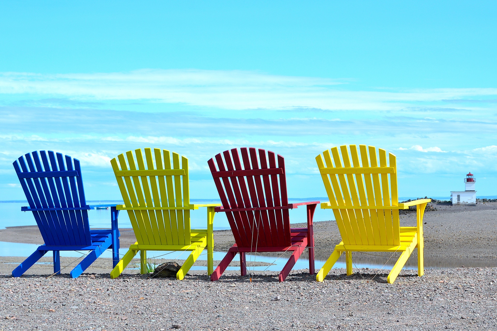Big chairs on the sandy beach.