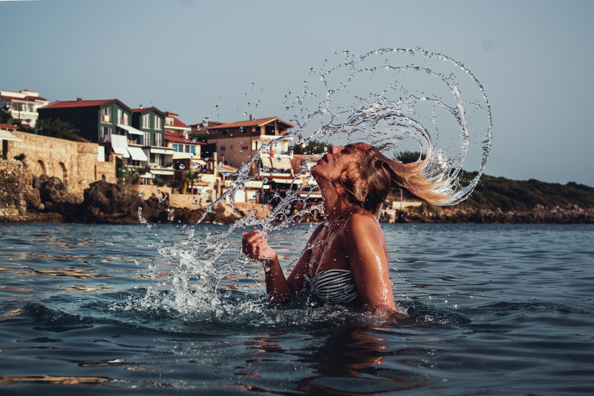 Girl Splashing Hair In The Sea