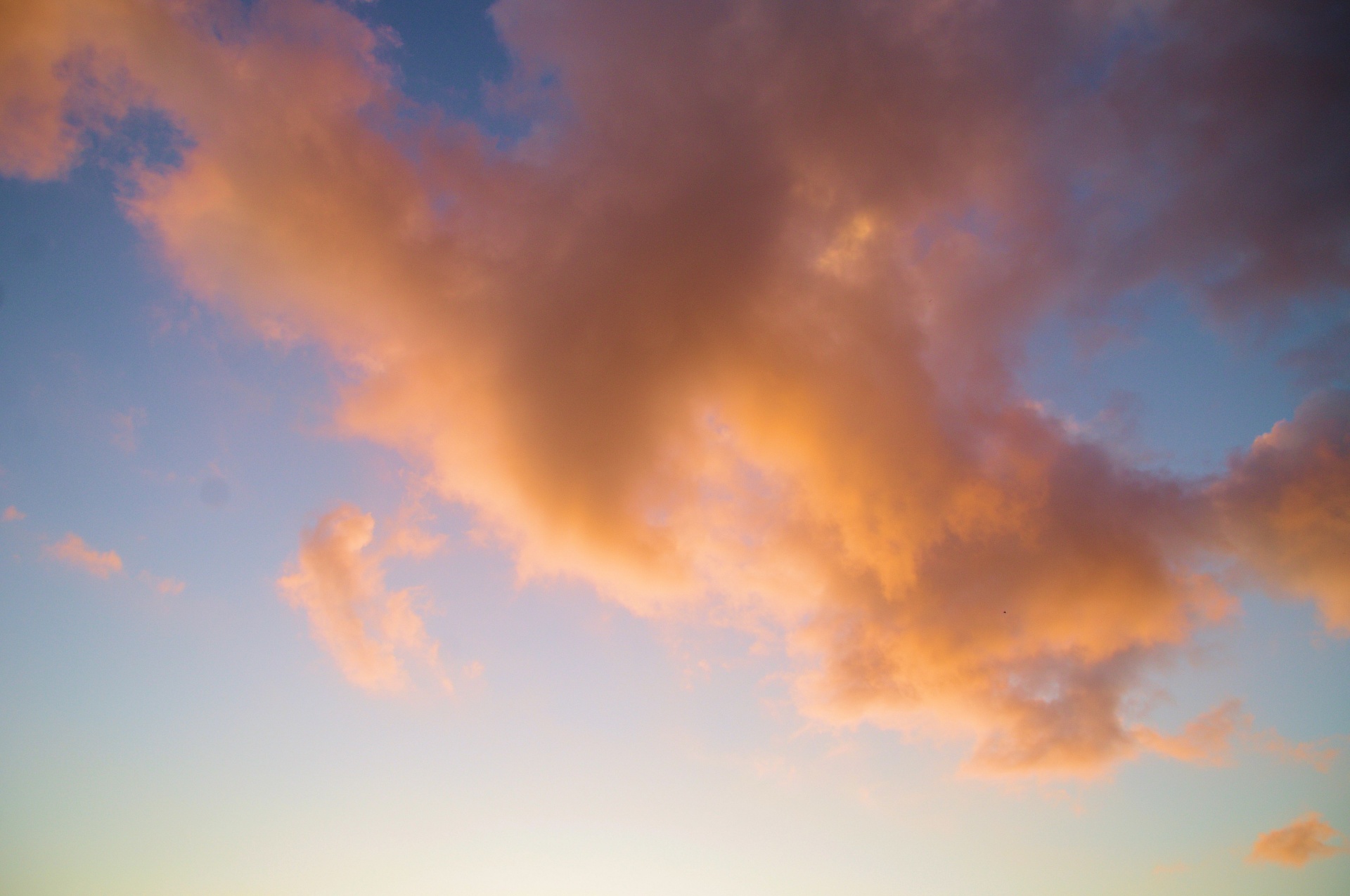 Pink Clouds Against Blue Sky