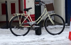 Bicycle Parked In The Snow