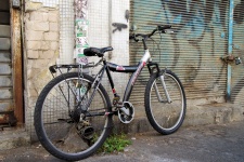 Chained Bicycle In Bad Neighborhood