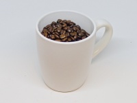 Coffee Beans In A Coffee Cup