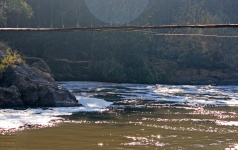Suspension Bridge Over River