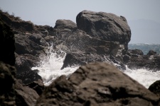 Waves Crashing Through Rocks