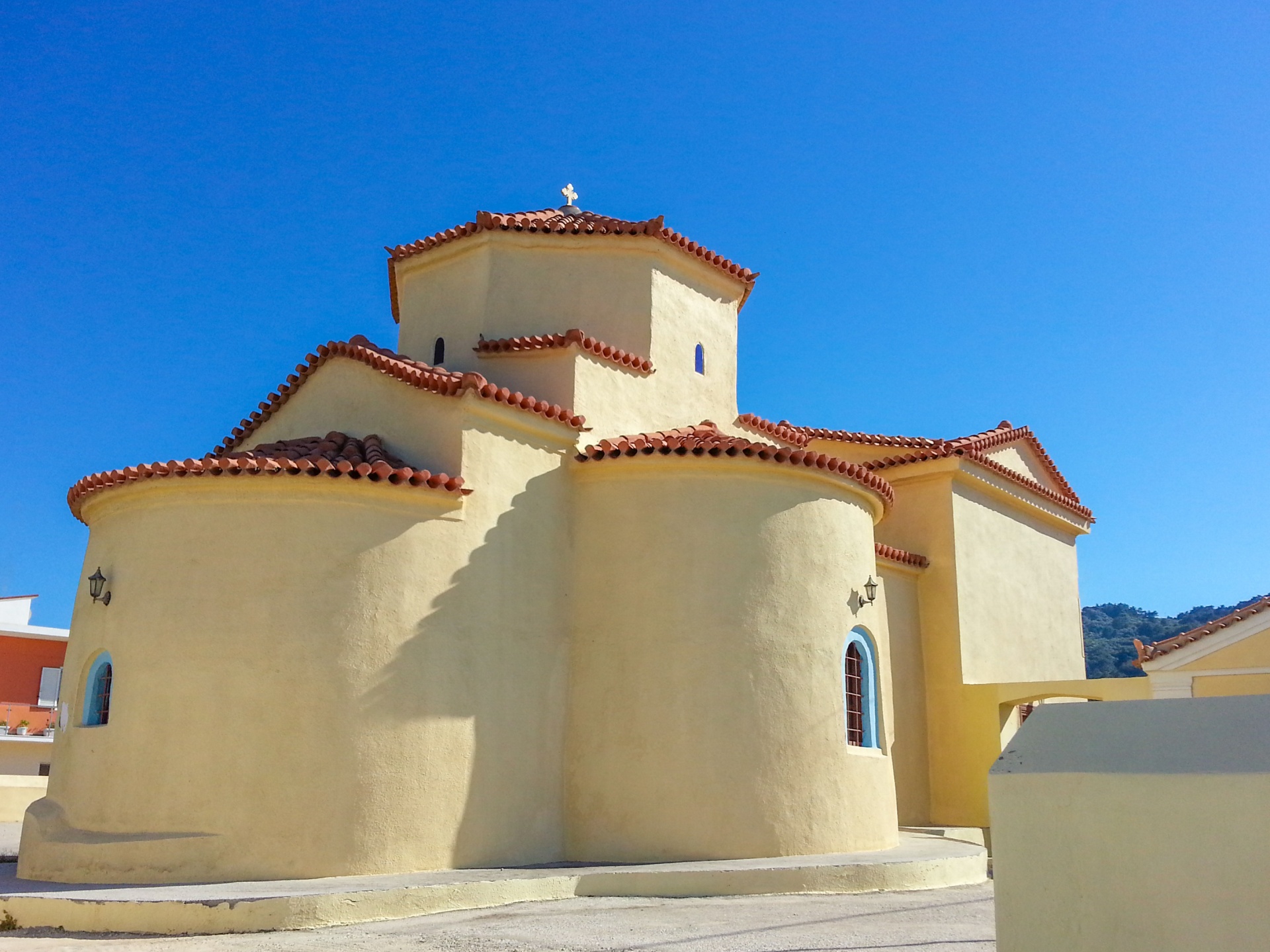 Yellow Greek church with blue sky