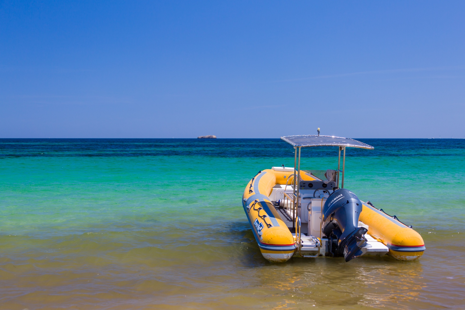 Inflatable Boat with blue sky and clear sky