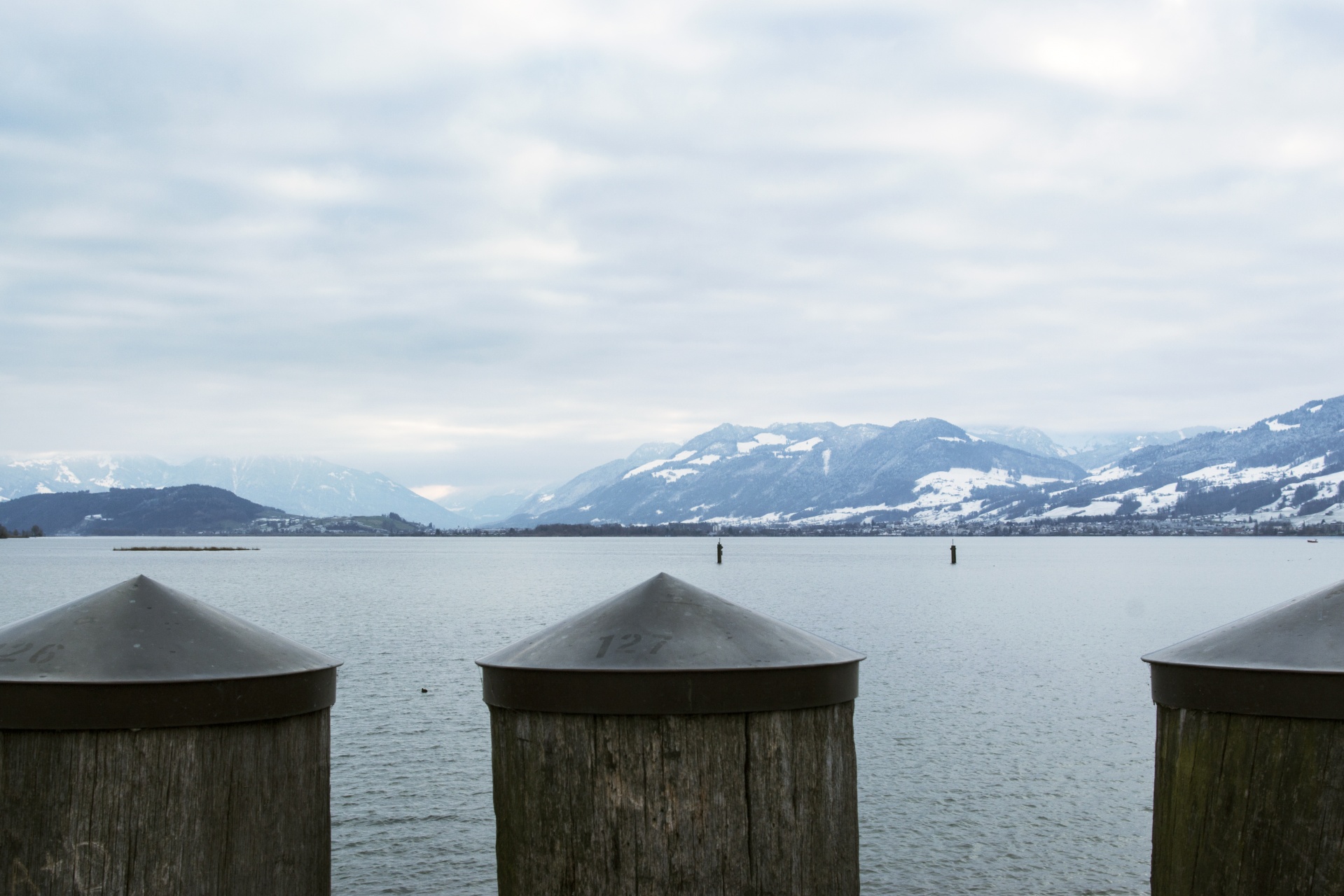 Wintry landscape with lake and mountains in Switzerland