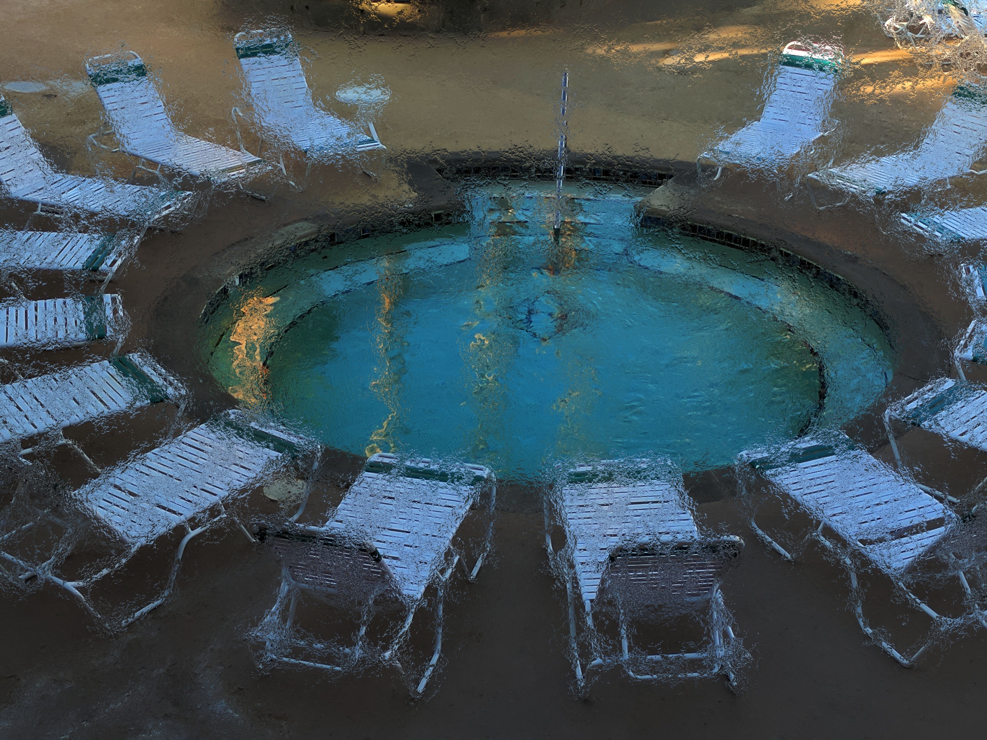 lounge chairs surround a mineral hot spa