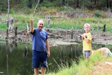 Little Boy And Grandfather Fishing