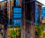 Old Building Behind Wire Fence