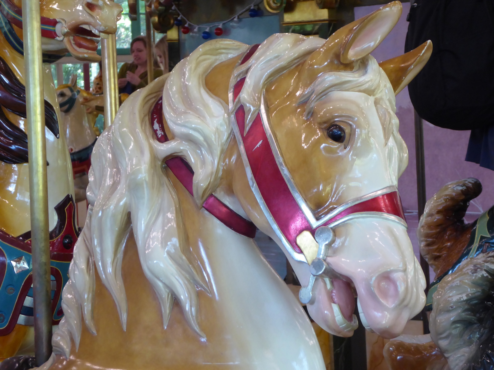 Dramatic white horse head on a carousel ride