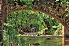 Arched Stone Bridge Over Creek
