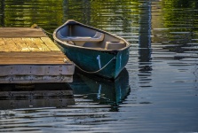 Docked Rowboat On Lake