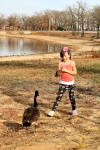 Little Girl Feeding Goose