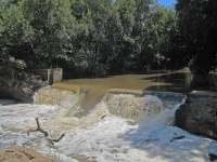 River Water Cascading Down A Weir