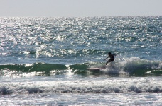 Silhouette Of Young Surfer Boy