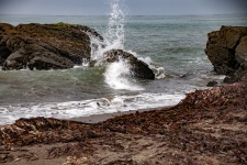 Wave Crashing On Rock