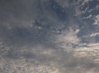 Wispy Gray And Cumulus Clouds