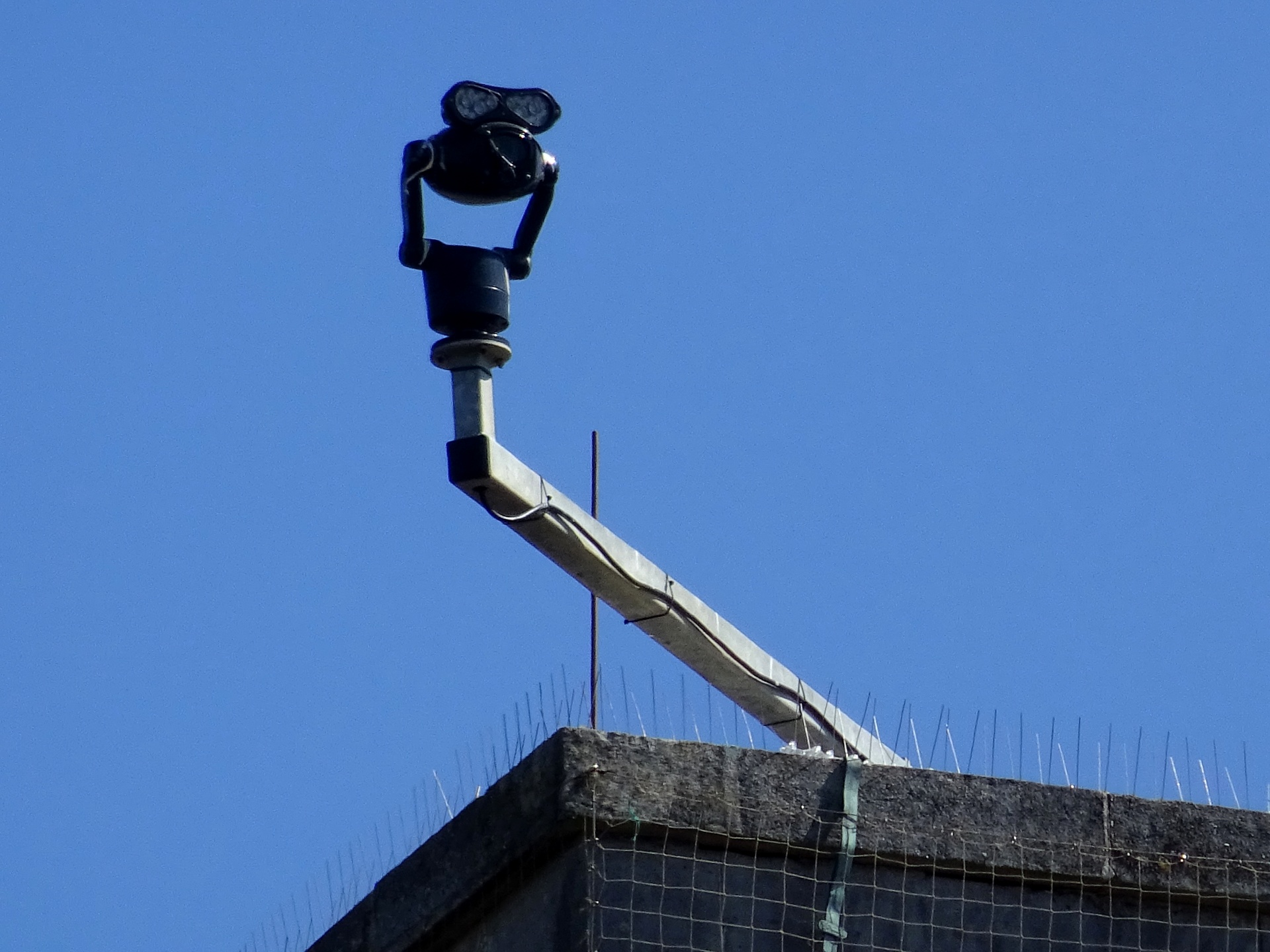 CCTV Camera On High Building Corner