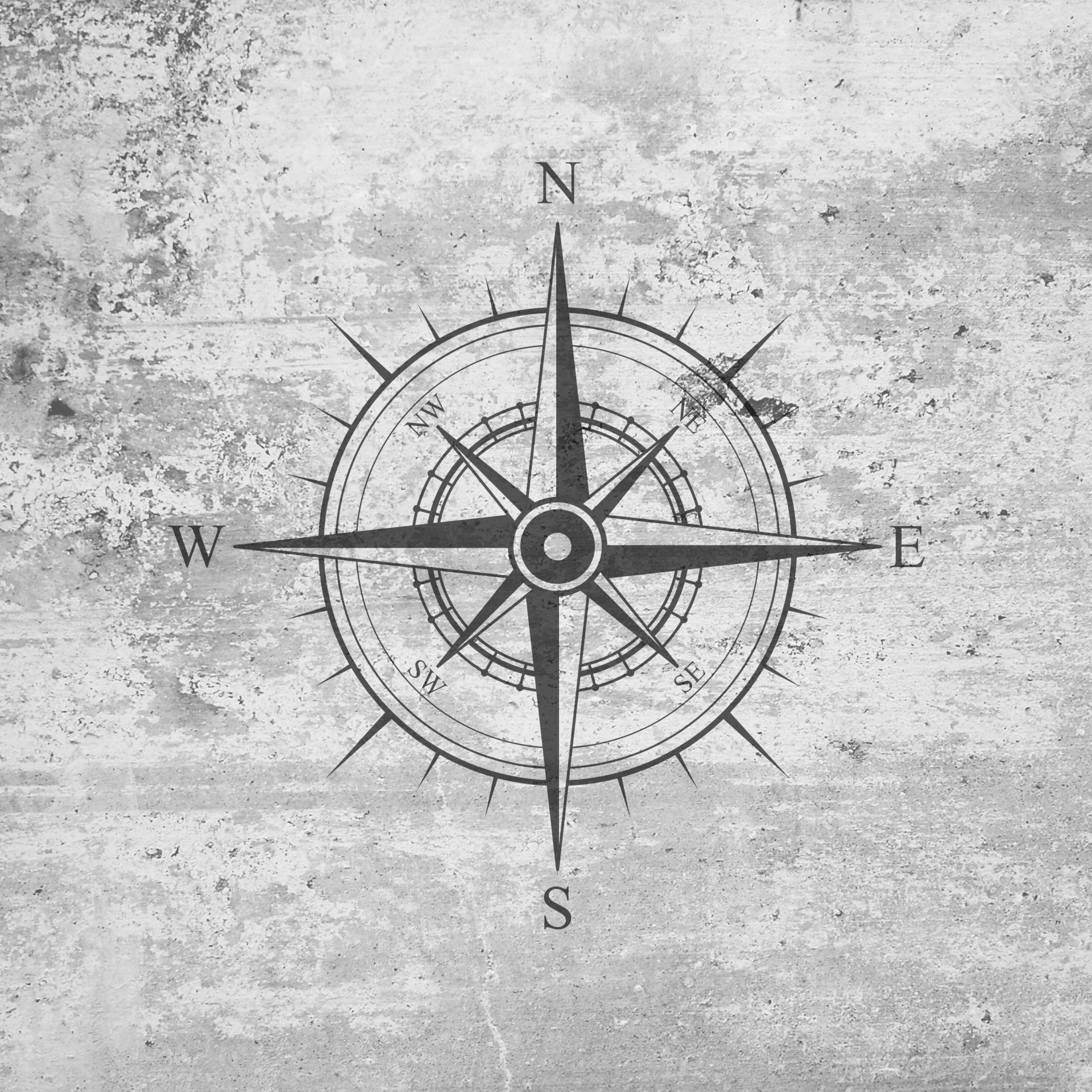 Compass rose on grunge vintage old concrete wall background