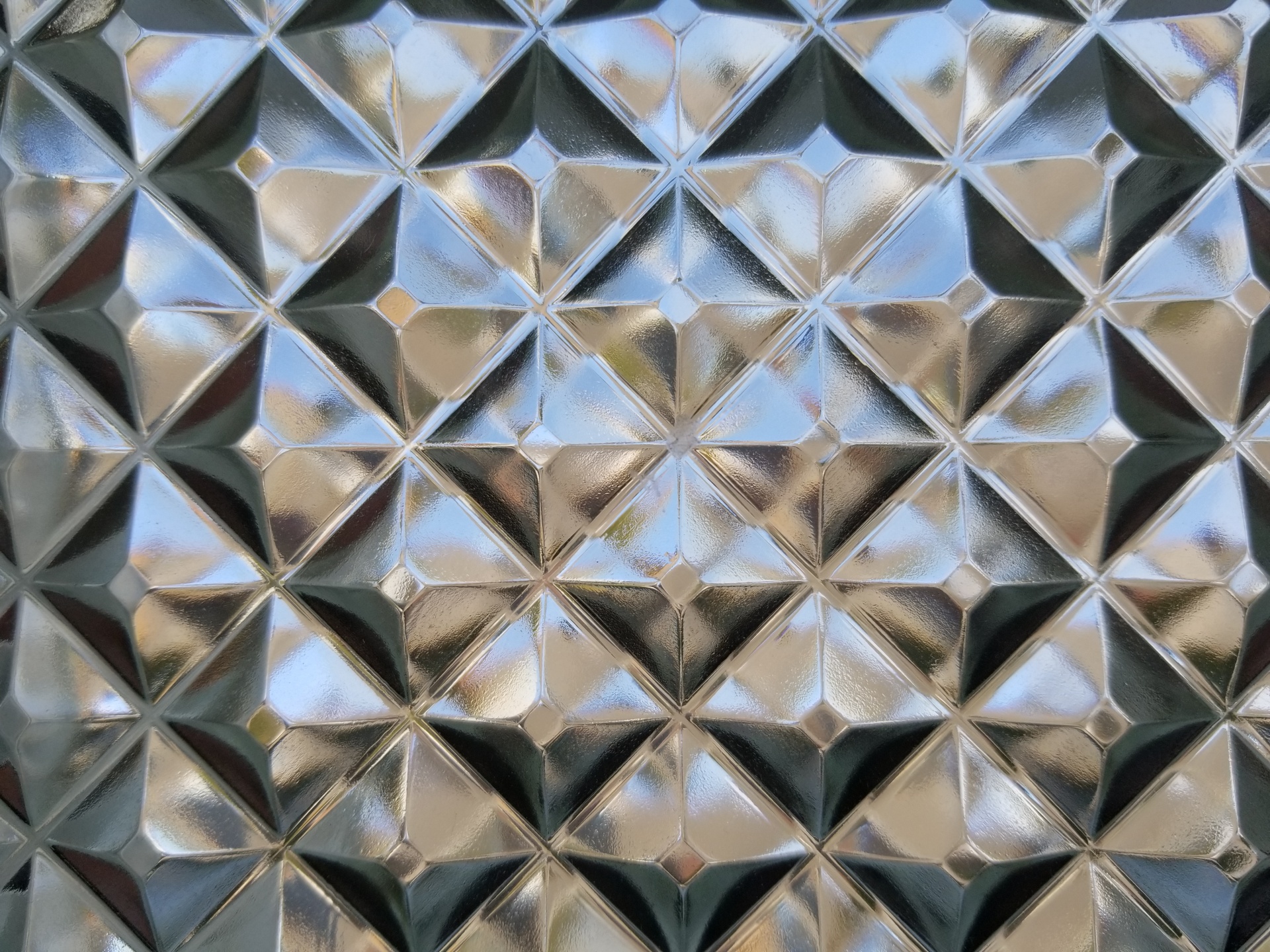 glass wall of diamond shaped glass blocks. Free image.