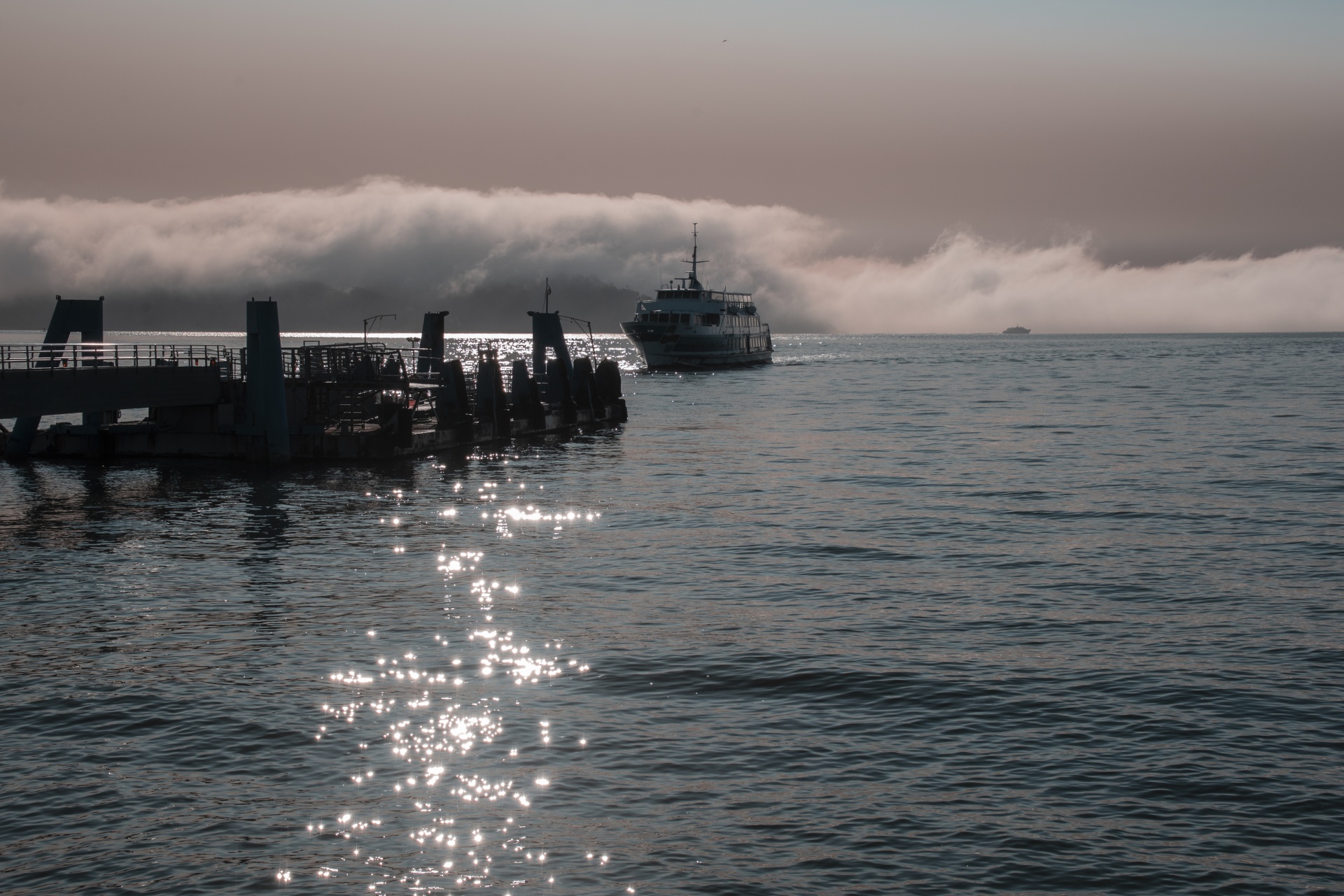 Sausalito pier ferry boat landing shows the morning ferry arriving to pick up passengers. Free image for personal or commercial projects