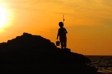 Boy Silhouette Fishing Sunset