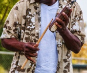 Musician Playing Cowbell