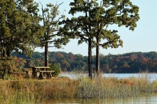 Picnic Table At Lake In Fall