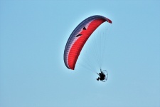Powered Paragliding On Blue Sky
