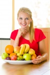 Woman With Bowl Of Fruit