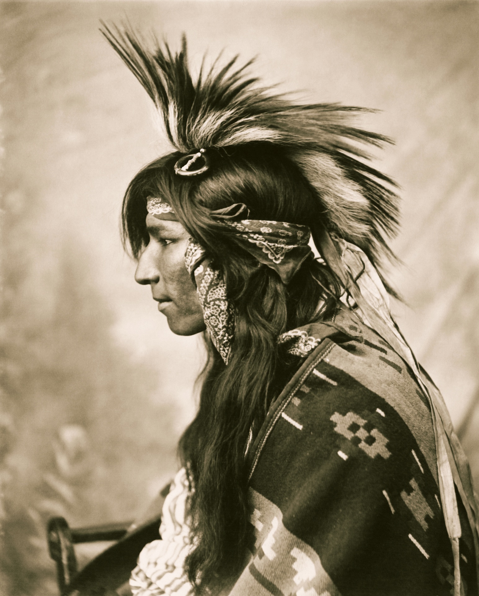 Vintage sepia portrait photo of a cree indian in profile
