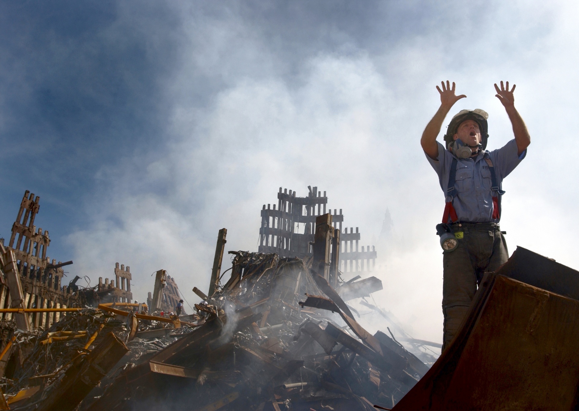 Fireman in burnt out rubble after 911 terrorist attack in New York