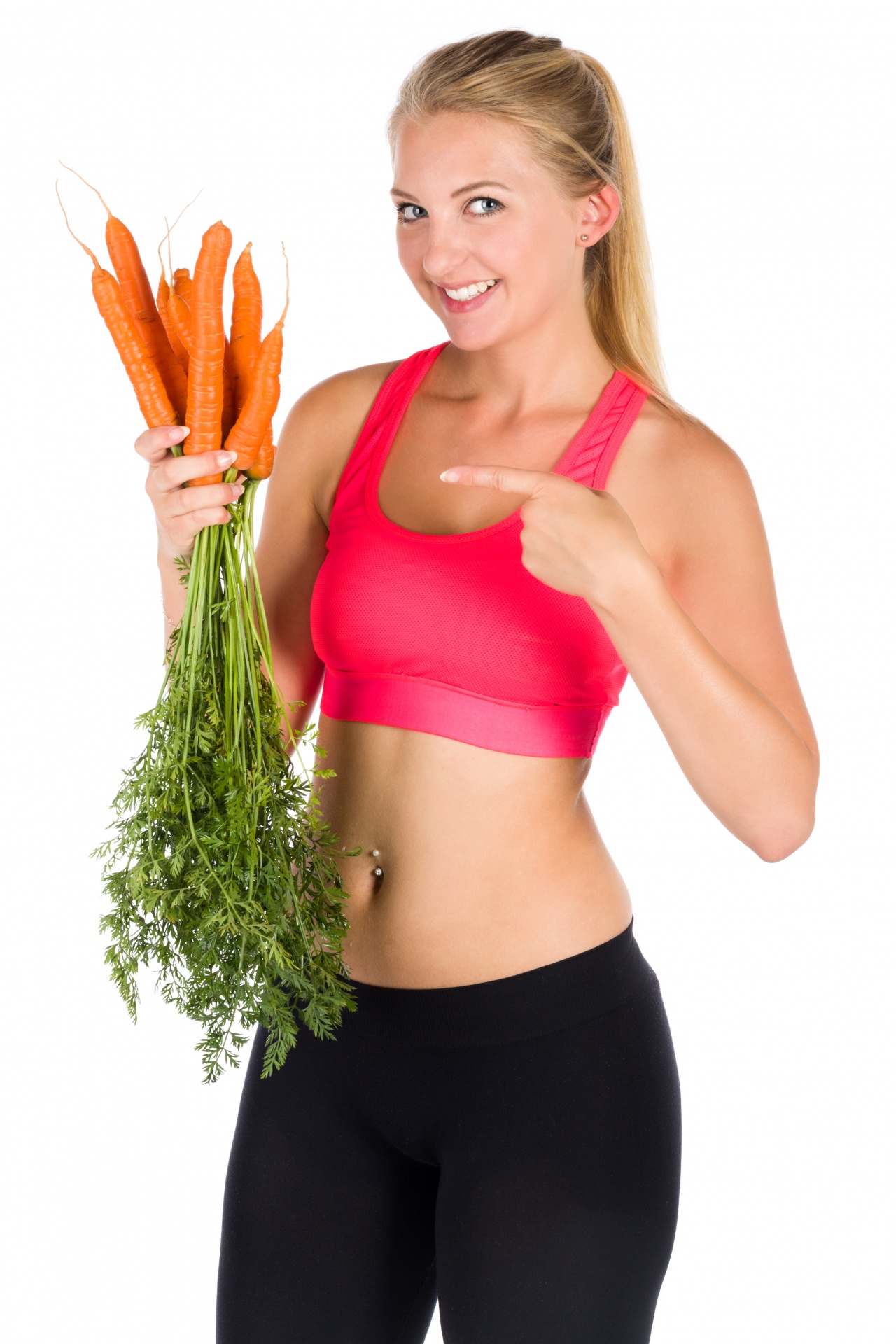 Young healthy woman holding bunch of carrots and pointing her finger isolated on white background