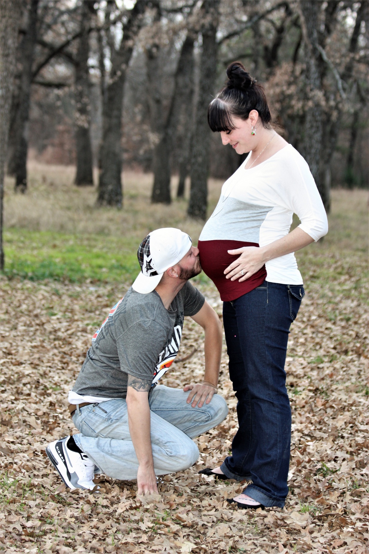 Pregnant Woman And Husband In Fall