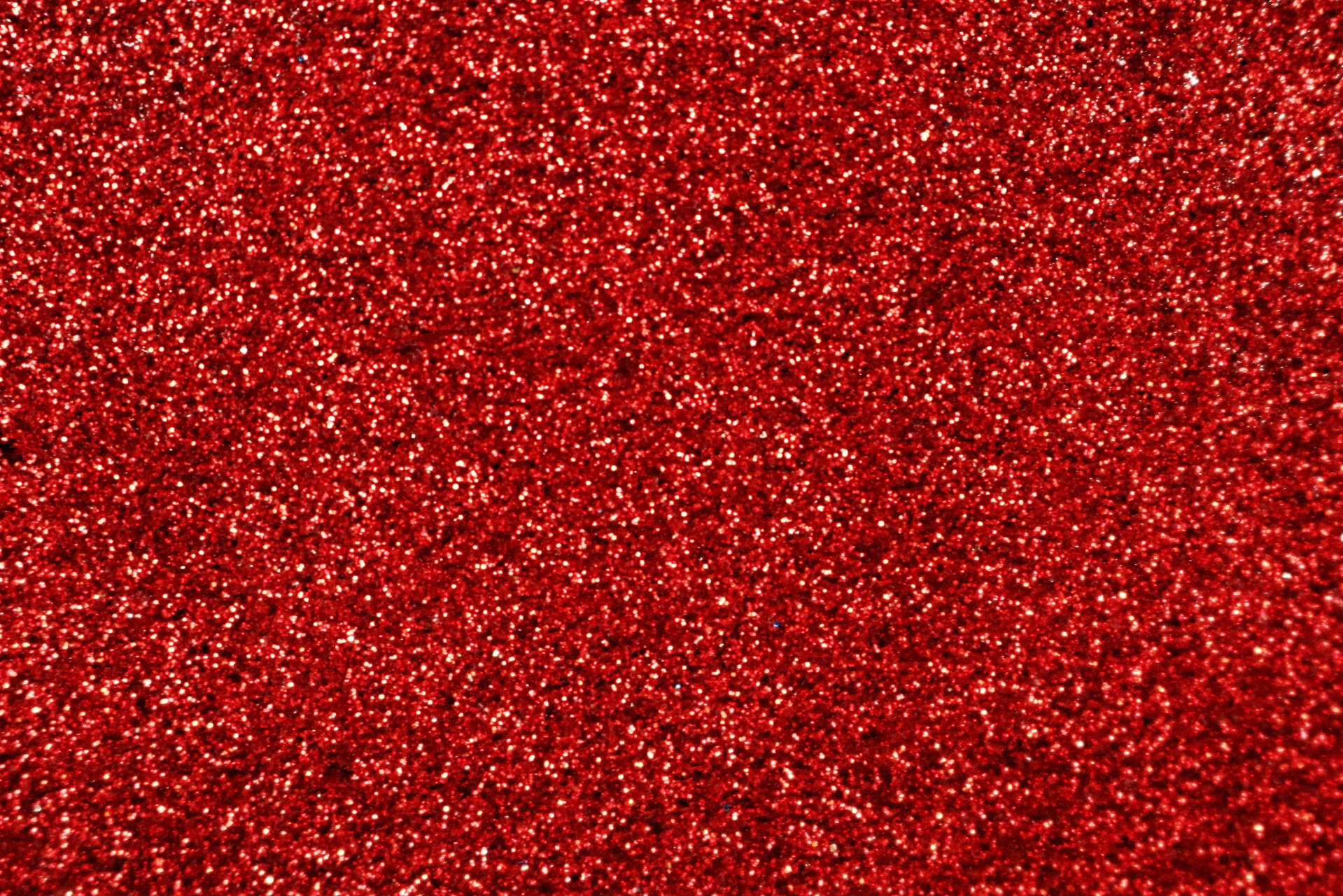 Red glitter sparkling background with room for text.