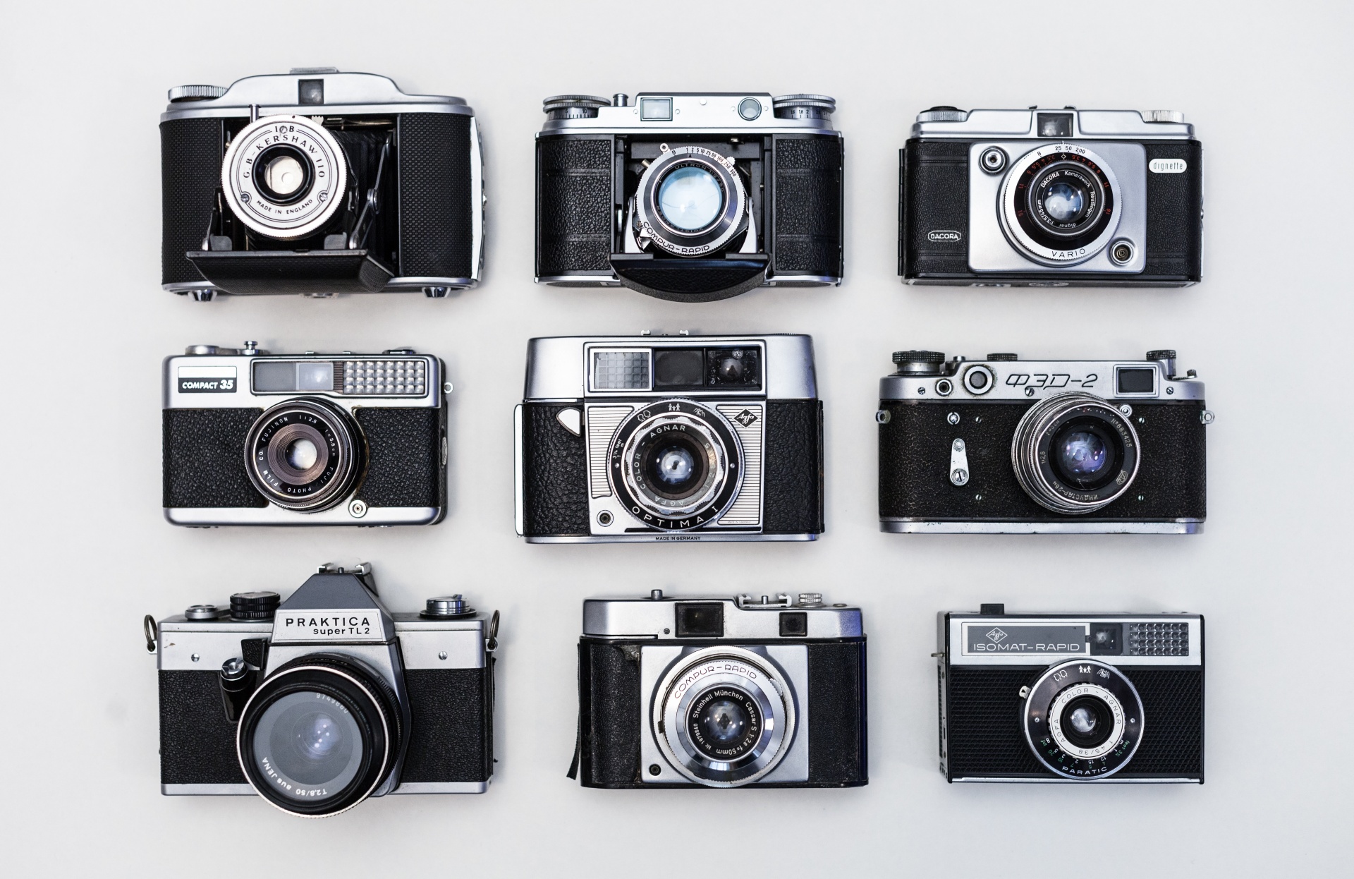Vintage old photo cameras on white background