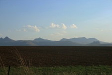 Arable Land And Distant Mountains