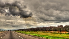 Highway Under A Cloudy Sky